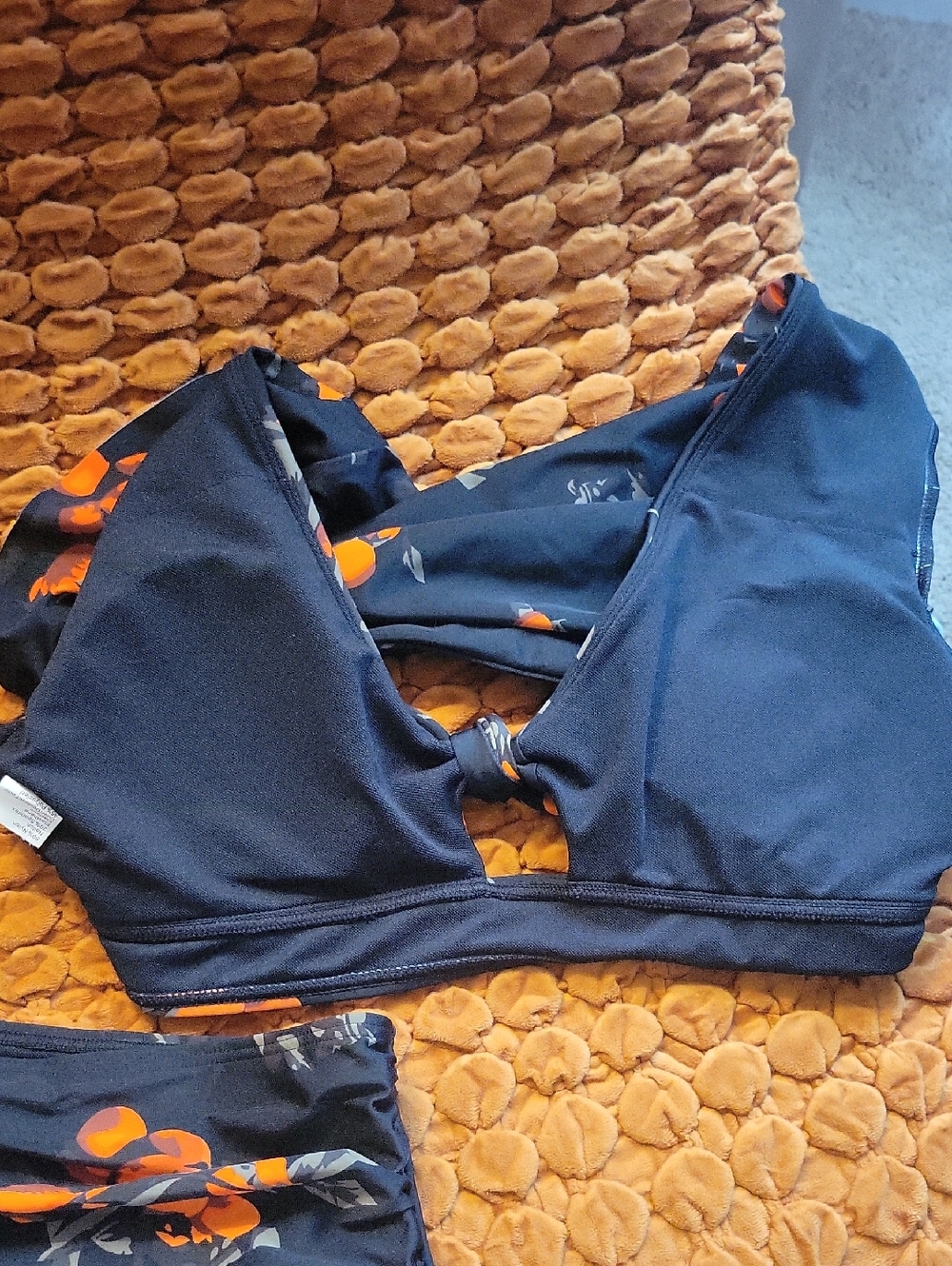 Black Two-Piece Swim Set with Orange Print. - Picture 2 of 2